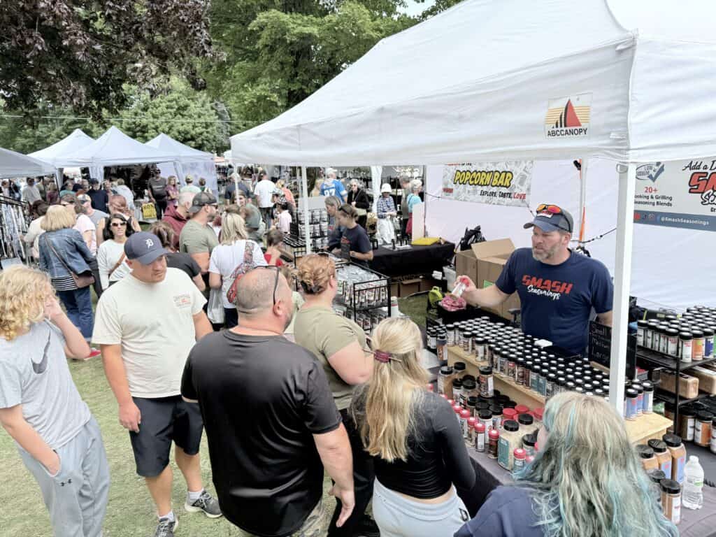 Sampling seasonings at a craft show